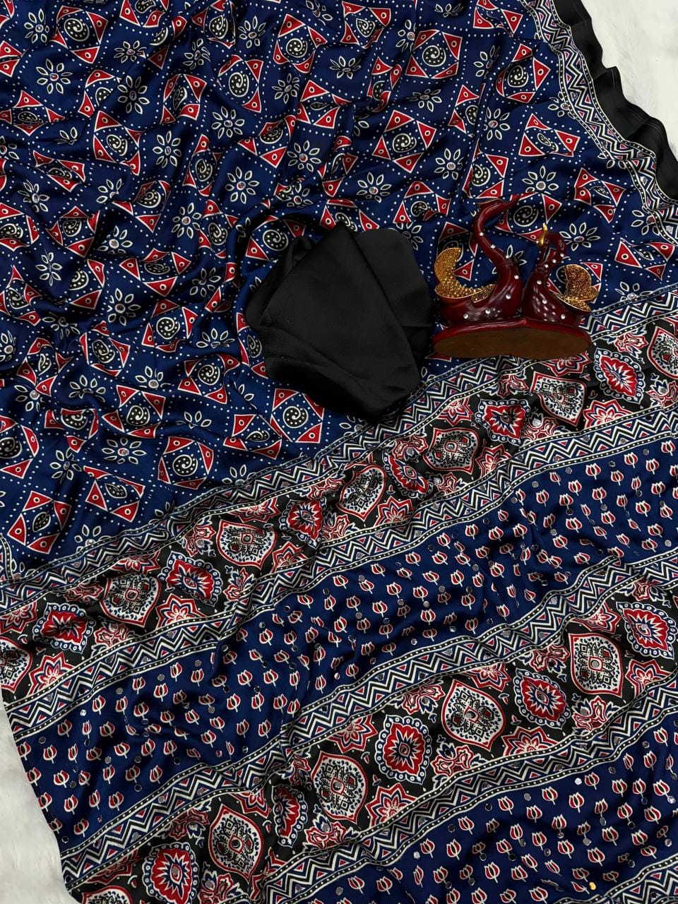 SAREE FAB. : Soft Japan Satin  ⭕ WORK : Beautiful Ajarakh print with Real mirror work and beautiful tussle  ⭕ BLOUSE Running Saree Fabric