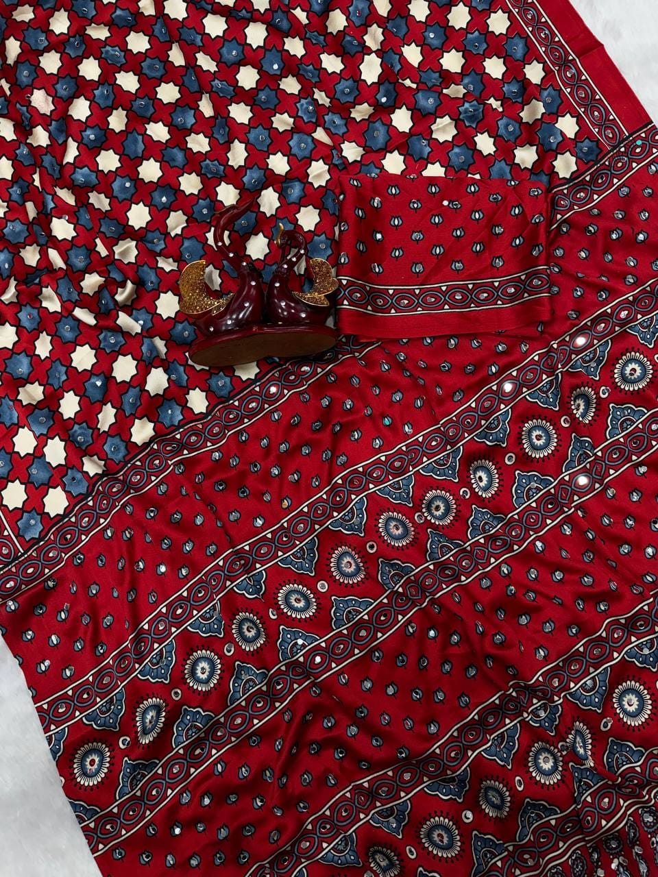 SAREE FAB. : Soft Japan Satin  ⭕ WORK : Beautiful Ajarakh print with Real mirror work and beautiful tussle  ⭕ BLOUSE Running Saree Fabric