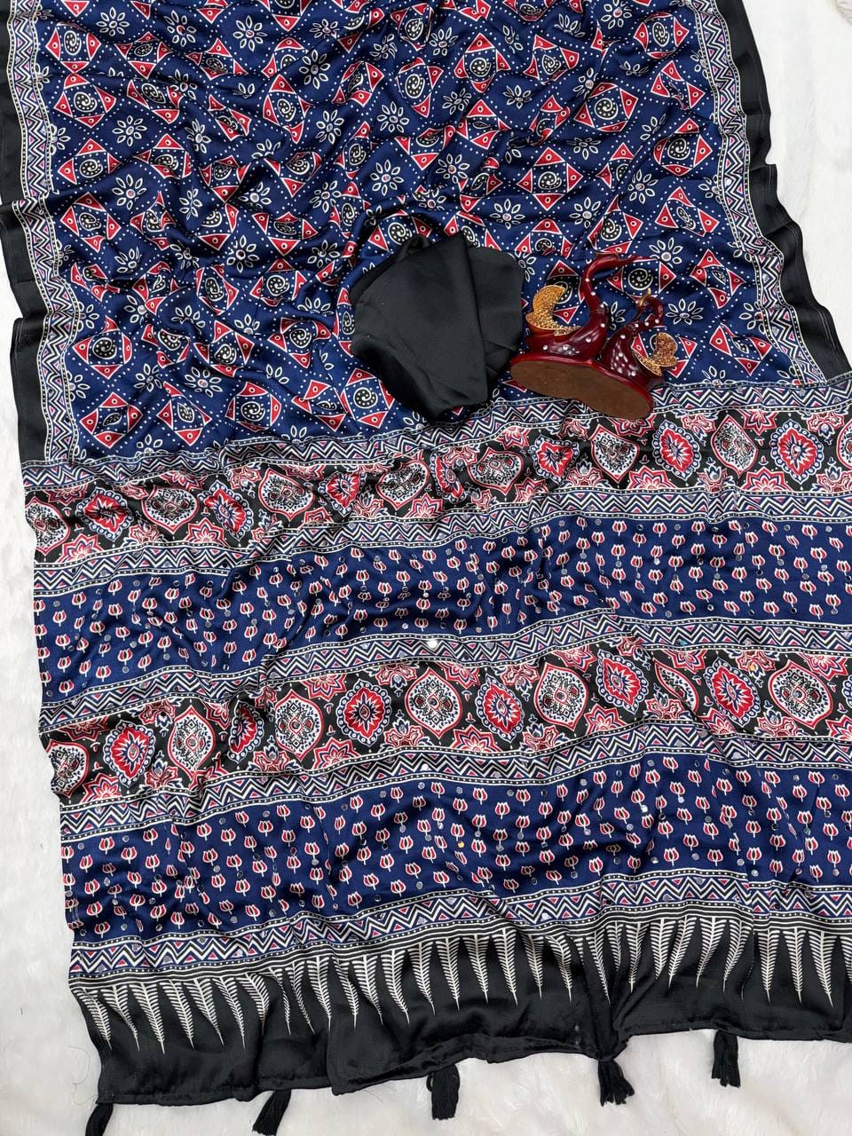 SAREE FAB. : Soft Japan Satin  ⭕ WORK : Beautiful Ajarakh print with Real mirror work and beautiful tussle  ⭕ BLOUSE Running Saree Fabric