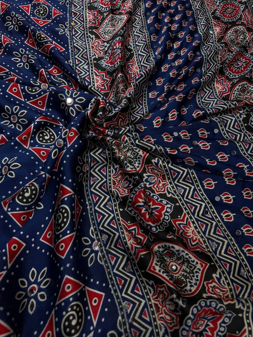 SAREE FAB. : Soft Japan Satin  ⭕ WORK : Beautiful Ajarakh print with Real mirror work and beautiful tussle  ⭕ BLOUSE Running Saree Fabric